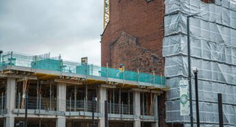 A building under construction with scaffolding around it