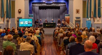 audience & panel at public event
