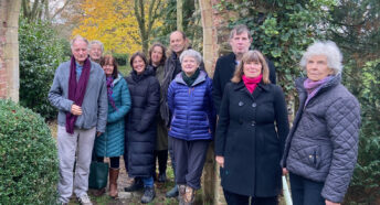 Ian Shepherd's family and CPRE Norfolk representatives in the grounds of Mannington Chapel gardens