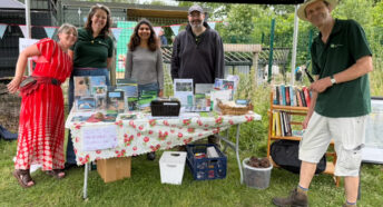 CPRE Norfolk volunteers and staff around their stall at Martha's Meadow
