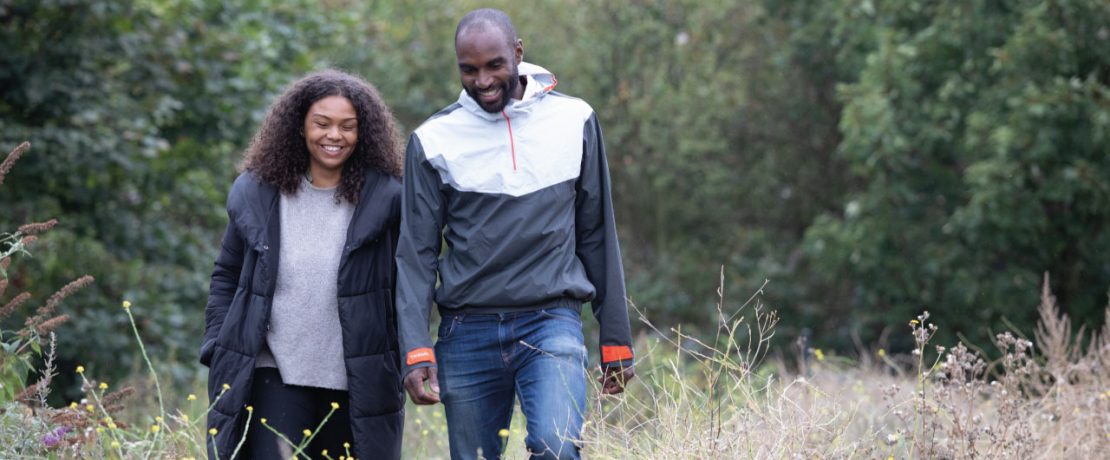 A couple walking and laughing together