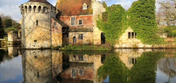 Scotney Castle reflected in water